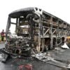 Bus catches fire after being hit by a motorcycle in southern India, killing at least 25