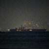 USS Abraham Lincoln sails past Singapore on its way home from Middle East